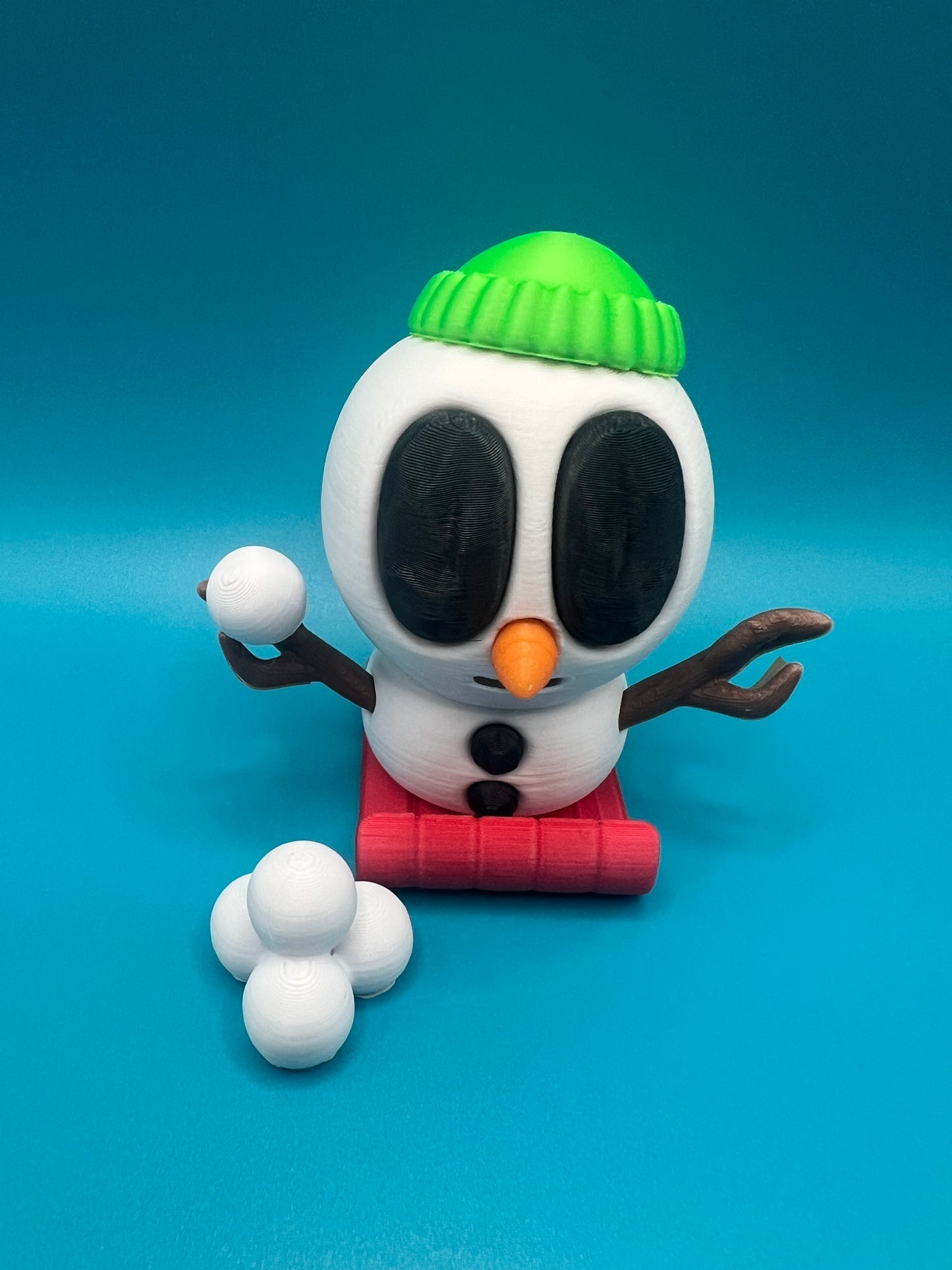 Blob snowman with beanie hat and snow balls!